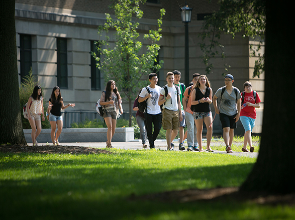 Summer Studies students walking across campus on a sunny day.