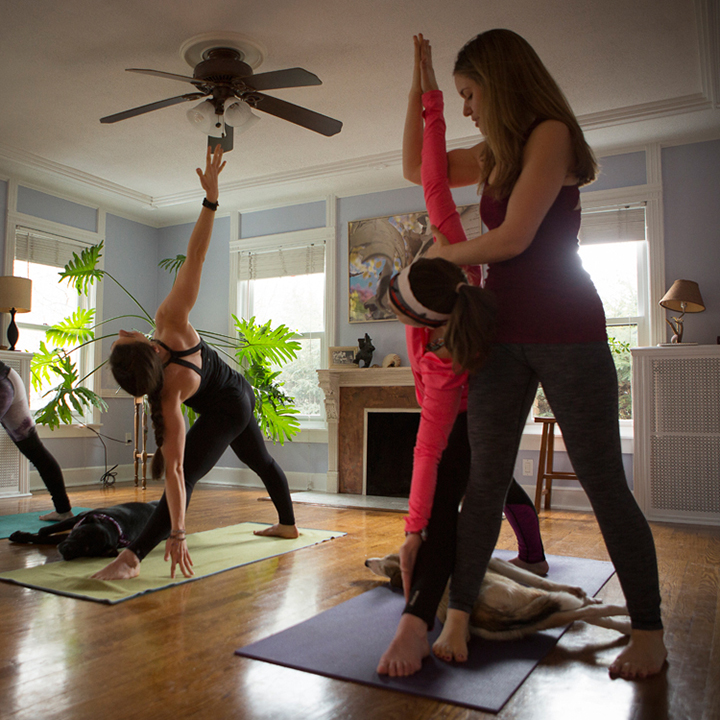 women doing yoga in a living room