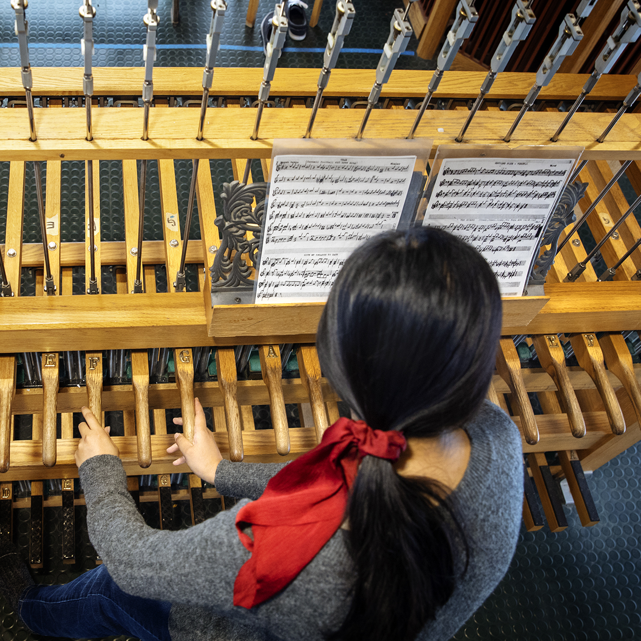 A student playing the chimes.